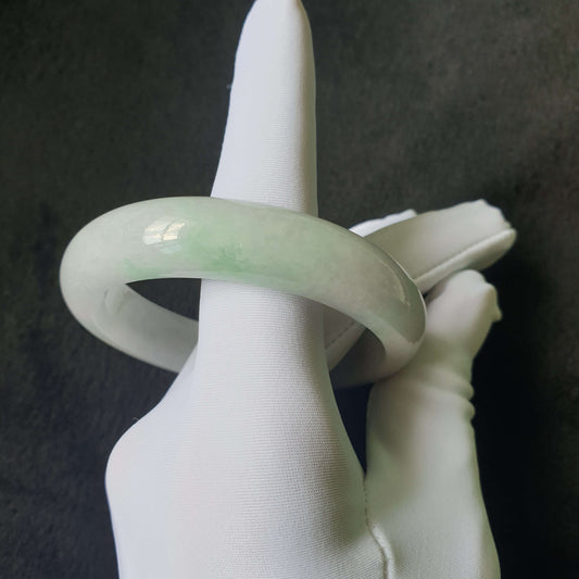 Close-up of jade bangle showing natural jade texture and translucency