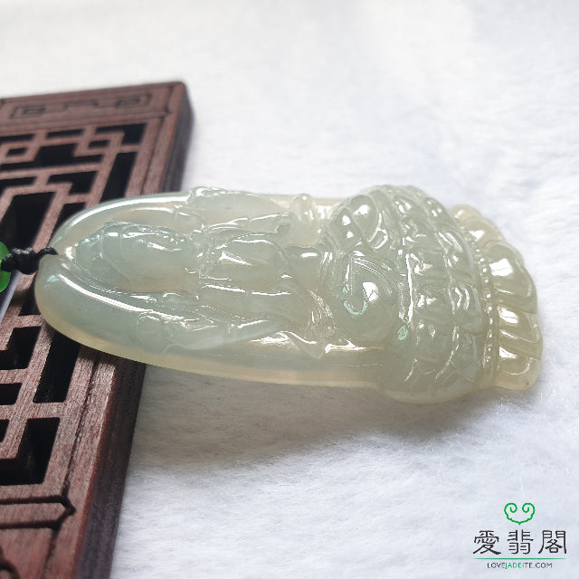 Side angle of natural jadeite Guan Yin pendant with smooth polish